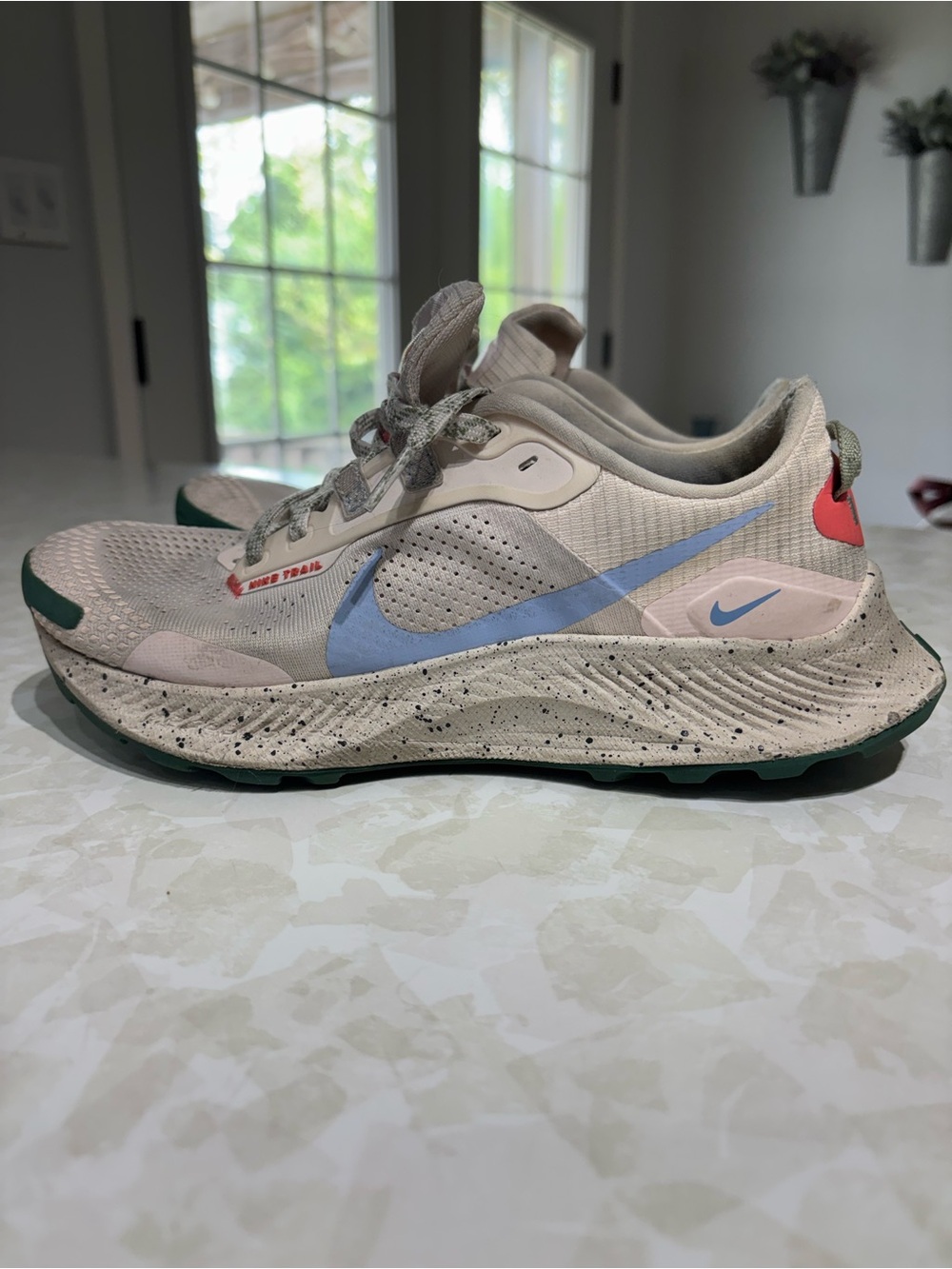 Nike Women's Beige Sneakers with Light Blue Swoosh and Green Outsole